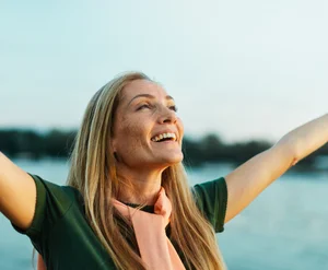 Person practicing somatic techniques outdoors