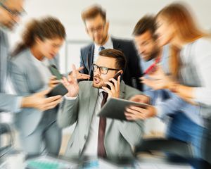 Stressed executive tries to calm nerves in a meeting