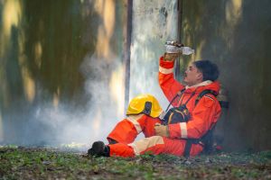Firefighter tries to cool down after battling fire